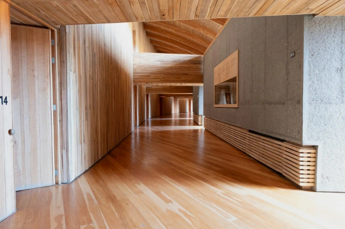 A wooden hallway with a modern, minimalist design.